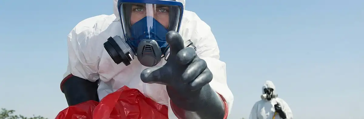 sewage clean up technician wearing protective gear handling biohazard materials in Columbia, SC