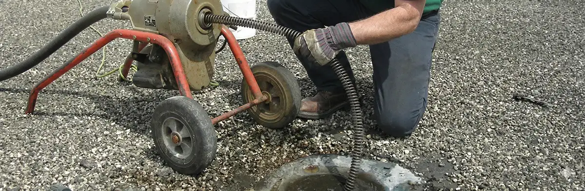 sewer rodding technician actively removing blockages from a sewer line in Columbia, SC