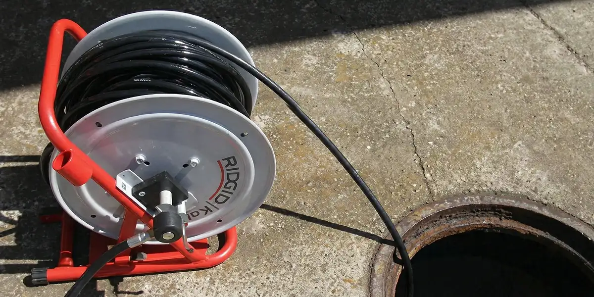sewer rodding equipment prepared to clear clogged sewer lines in Columbia, SC
